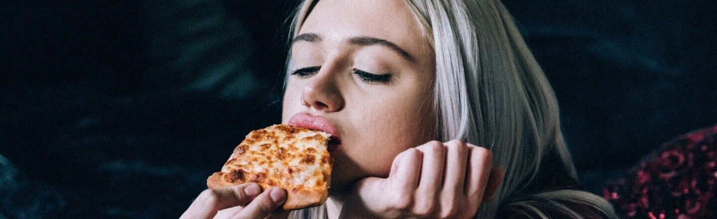 Girl eating pizza