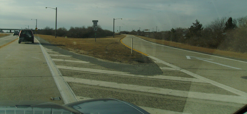 Exit for Robert Moses Causeway on the Ocean Parkway, near where the first body was found