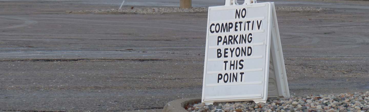 NO COMPETITIN PARKING BEYOND THIS POINT 