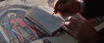 Henry Jones sketching in a notebook