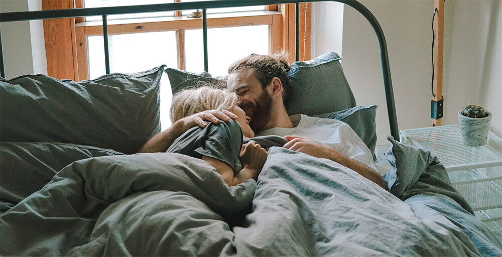 man woman bed