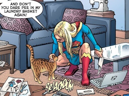 Supergirl asks her cat not to urinate in her laundry basket.