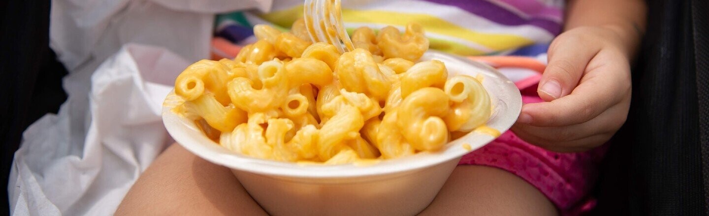 Child eating macaroni and cheese