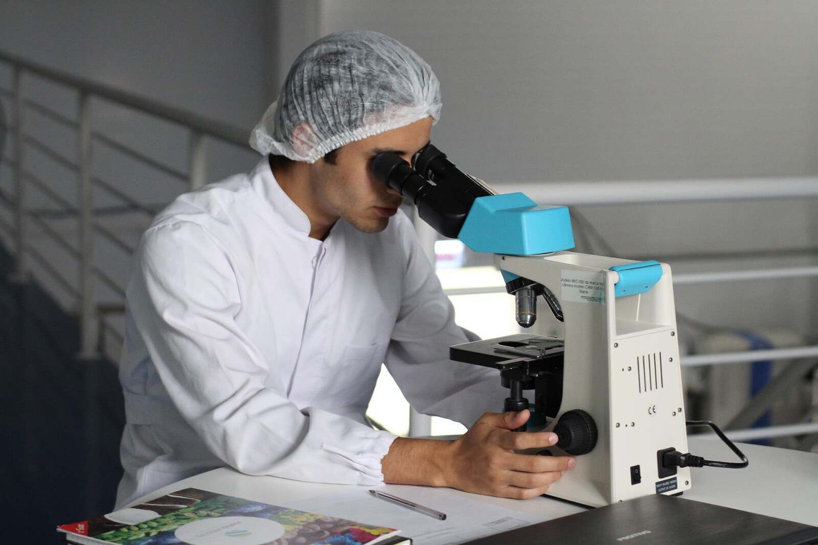scientist in microscope