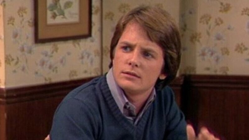 A Fan Theory Explains Why Alex P. Keaton Exists in Another Michael J. Fox Sitcom