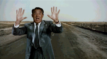 Carey Grant holding his arms up