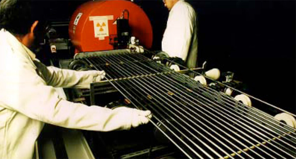 Nuclear fuel pellets being assembled into fuel rods.
