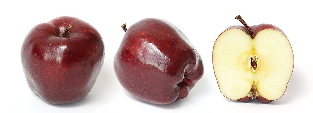 Red Delicious apple and its cross section isolated on a white background