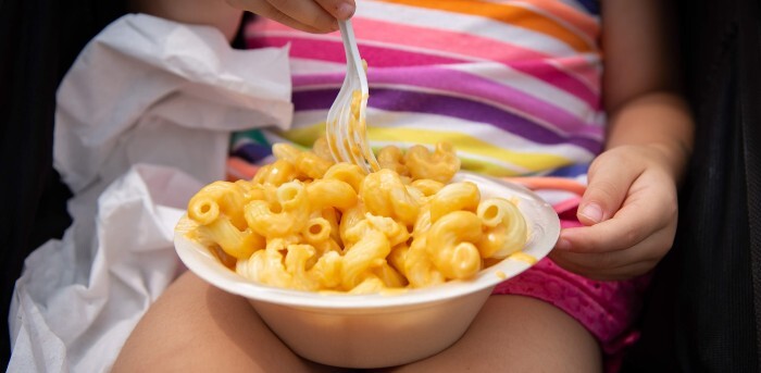 Child eating macaroni and cheese