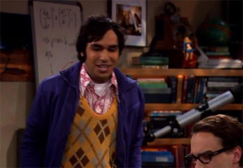 Raj in front of a whiteboard