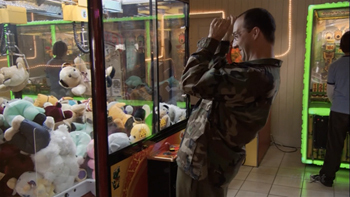 Buster playing a claw machine