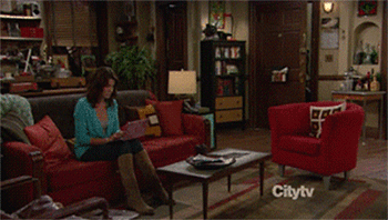 Lily walking into the apartment