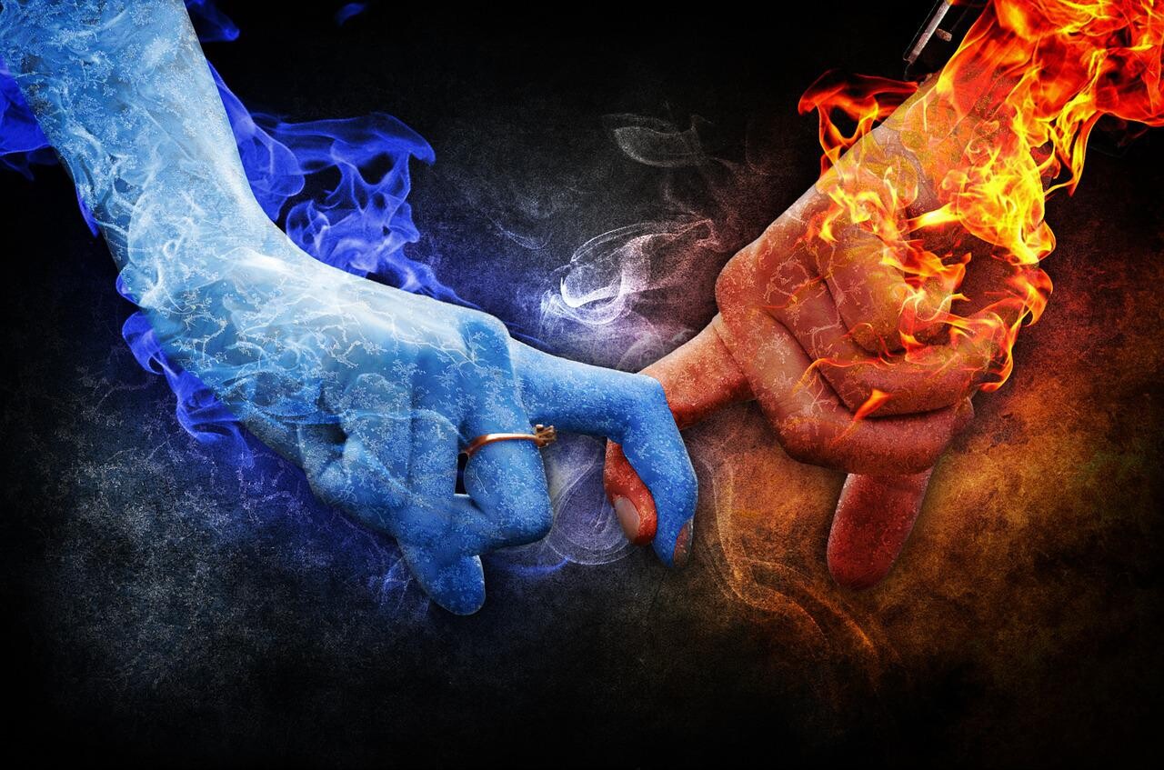 fire hand and ice hand touching