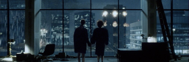 The narrator watches the city burn