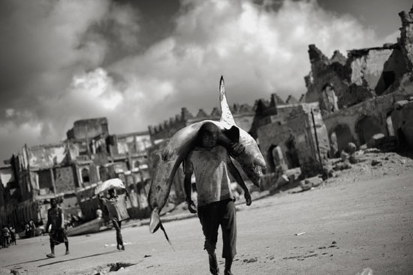 5 Badass Photos of People Walking Through Insane Situations