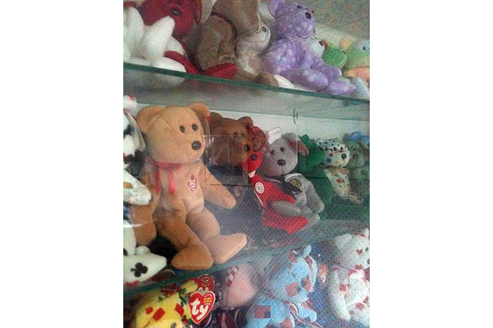 Ty Beanie Baby bears, in a display case.