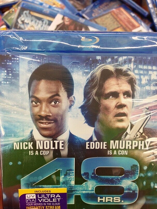 WITH b NICK NOLTE EDDIE MURPHY IS A COP IS A CON 11 INCLUDES UV ULTRA пл VIOLET HRS. YOUR MOVIES IN THE CLOUD INSTANTLY STREAM 