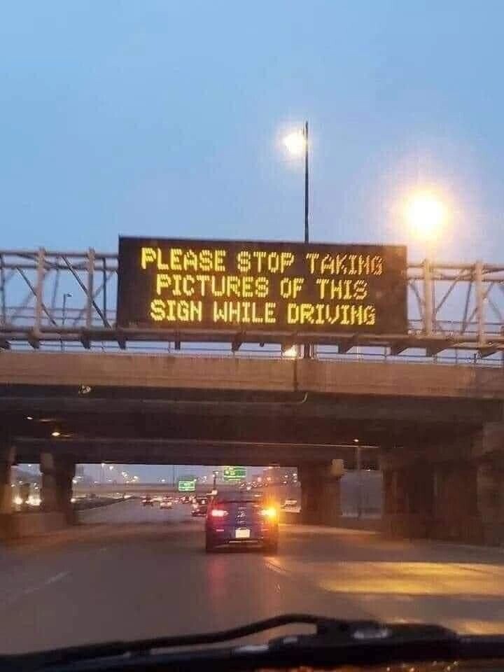 PLEASE STOP TAKING PICTURES OF THIS SIGN WHILE DRIVING