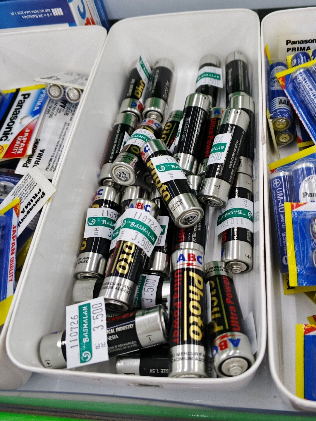 AS'V BIS VV/E-WNS/D31 AGA x6 = 24 Batteries Panason PRIMA freed Donce 110726 E 1.3k PRIMA Panasonic E I a NASMALAH 3 .500 Special for LEA LUGRIC Pho + Special for AAA D i 2 I In S AA in I | GO MERCURY A + UM-AUTR العربي RCUR (RO3UTN/281 $ SN 04-2051.2-2004 H I MAY EXPLODE Ultra Power Supplement S و I daily 2 I O CONNE JAPAN QUALITY 0726 PT. INTERNATIONAL CHEMICAL INDUSTRY BASMAL 3 oto 126 MADE IN INDONESIA lo -5 C ALAH MADE IN INDONESIA A Photo 500 PT.INTERNATIONAL CHEMICAL INDUSTRY 1107 GE IN FIRE ICAU BA A Panasonic PRIMA PERHATIAN: