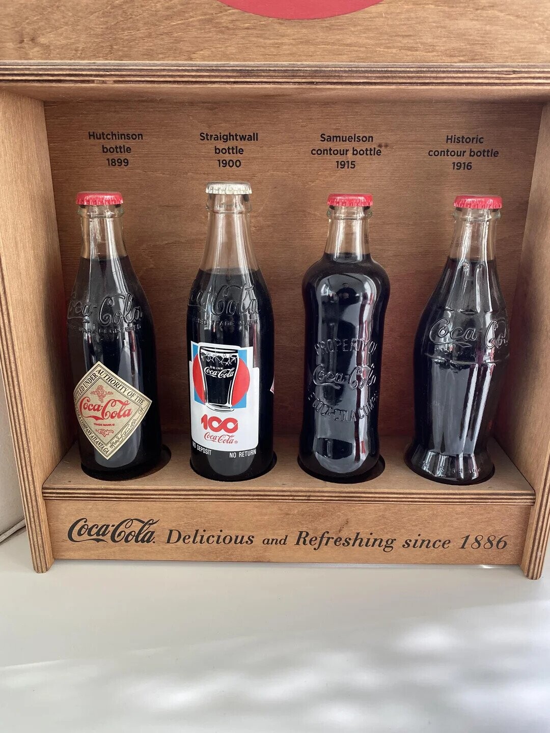 Hutchinson Straightwall Samuelson Historic bottle bottle contour bottle contour bottle 1899 1900 1915 1916 Coca-Cola Loa Colo GREG PADE mar REGISTERED Coca Col PROPERIYO RITLED UNDER Coca-Cola AUTHORITY OFT COMPANY THE Coca-Cola Coca-Cola Of MARK 1CO ATLANTA,GA Coca-Cola NO DEPOSIT was NO RETURN Coca-Cola Delicious and Refreshing since 1886