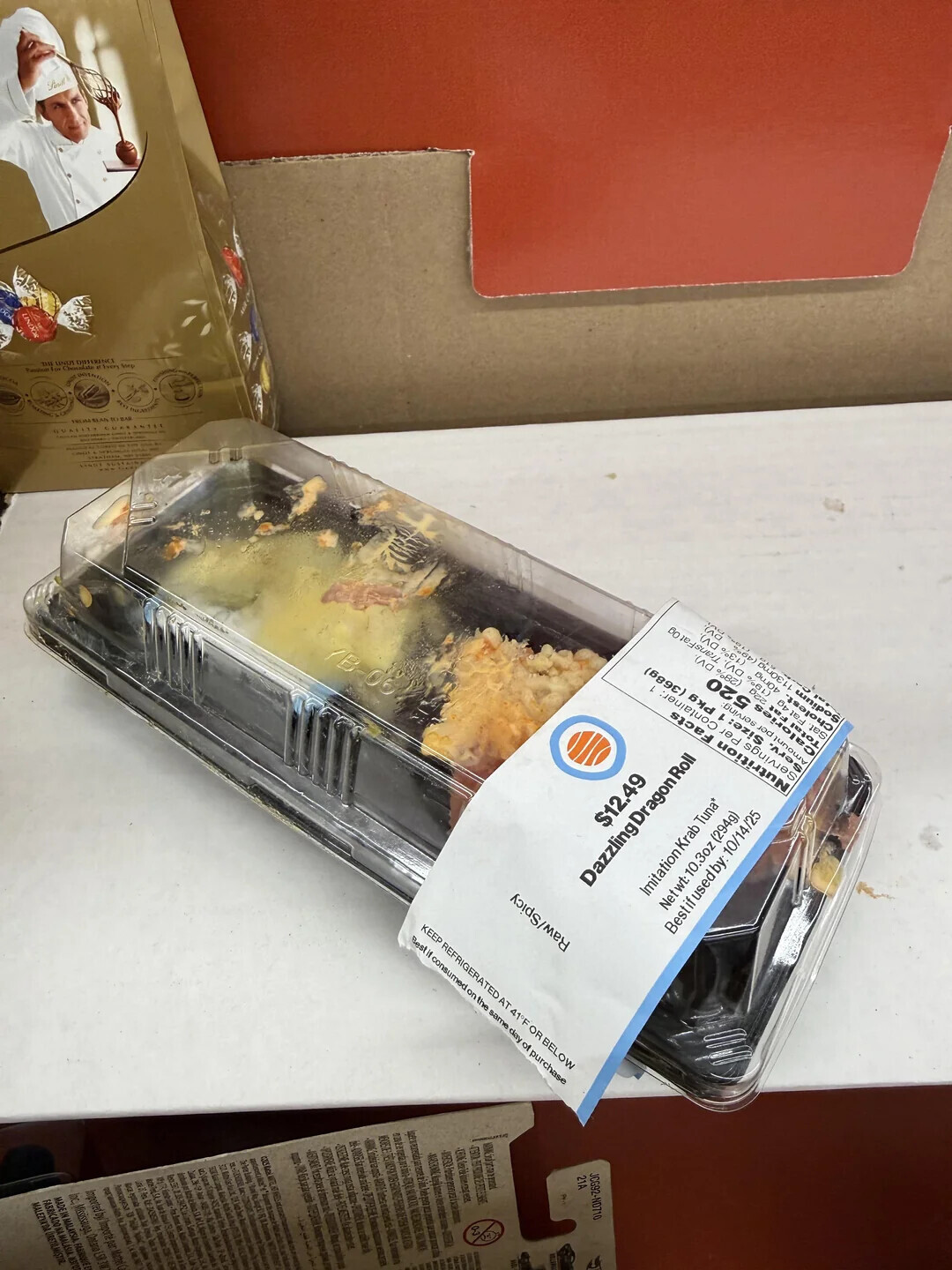 Pearl LINDOR THE DISTERINCE when Step INVENTION الال accu I BEAS INTERNATIONAL ٠١٠١٠ CUX GU ad DV). %EL) (699E) 40mg (19% 06 %8) TransFat 0g BLS DV). / to Daz Amount per serving: Tot Ca lories ... a i BY Fat Sat. i h State Cholest. **** Dazzling Dragon Roll 10 Servings Per Imitation Krab Tuna* Nutrition Facts $12.49 Netwt: 10.3oz (294g) Bestifused by: 10/14/25 KEEP REFRIGERATED AT 41 F OR BELOW Bestif consumed on the same day of purchase Raw/Spicy - 1805E el ONE FIAT O a NTW -STREET des are in -46TSNEK Finesta e Anúcia BY R imported be Importe par Mathel MADE IN MALAYSIA. FASHIQUE