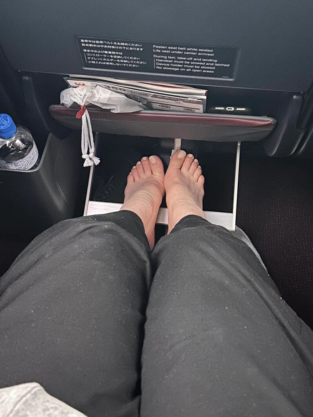 Fasten seat belt while seated Life vest under center armrest During taxi, take-off and landing Handset must be stowed and latched Device holder must be stowed No stowage on all open areas