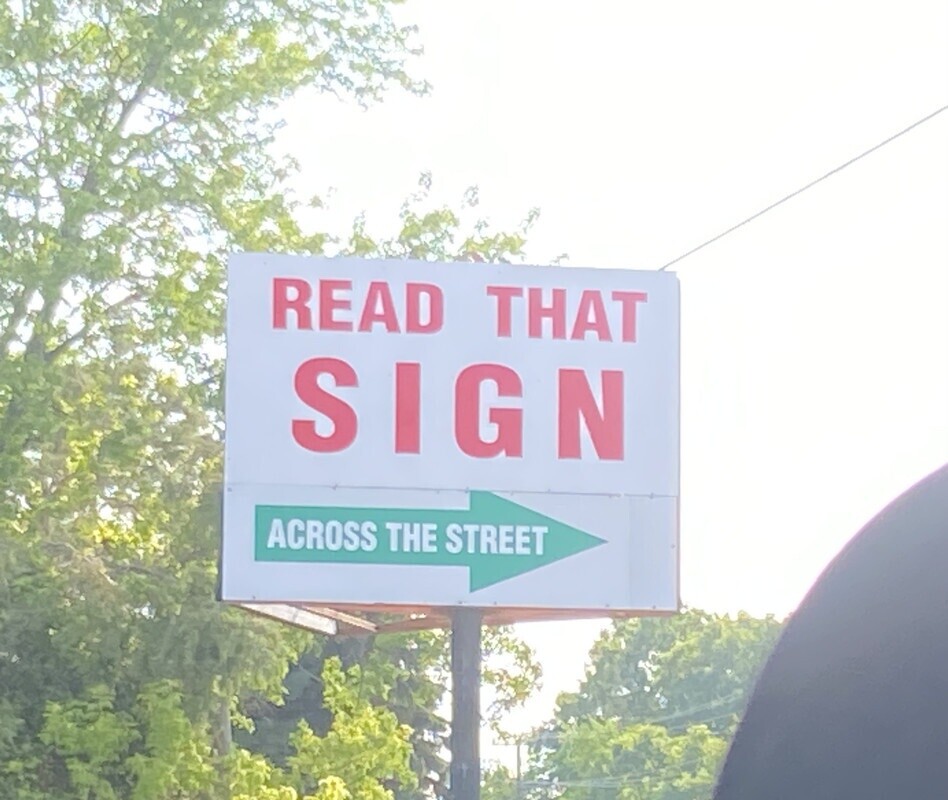 READ THAT SIGN ACROSS THE STREET