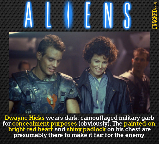 ALOENS Dwayne Hicks wears dark, camouflaged military garb for concealment purposes (obviously). The painted-on, bright-red heart and shiny padlock on