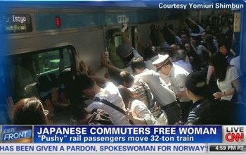 Courtesy Yomiuri Shimbun For Isogo wtxal on JAPANESE COMMUTERS FREF WOMAN LIVE FRONT Pushy rail passengers move 32-ton train CNN HAS BEEN GIVEN A PAR